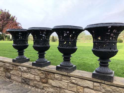 Pair cast iron urns pierced and foliate design
