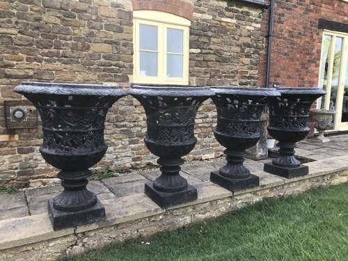 Pair cast iron urns pierced and foliate design