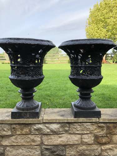 Pair cast iron urns pierced and foliate design