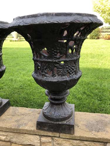 Pair cast iron urns pierced and foliate design