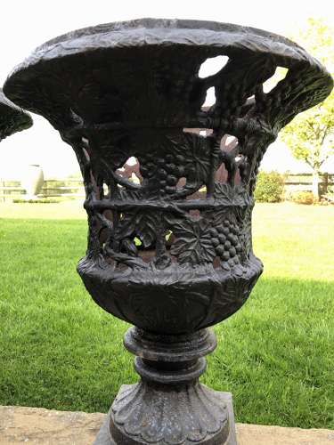 Pair cast iron urns pierced and foliate design