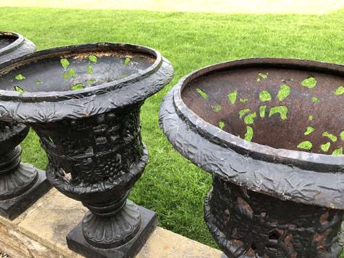 Pair cast iron urns pierced and foliate design