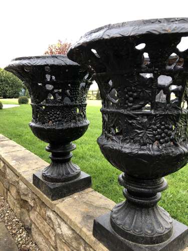 Pair cast iron urns pierced and foliate design