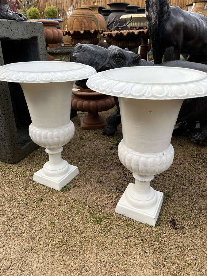 Pair of Rusty white cast iron campagna urns - cast iron planters