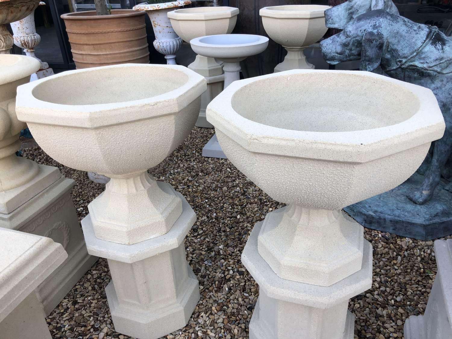 Pair of Hexagonal Stone Urns and Plinths
