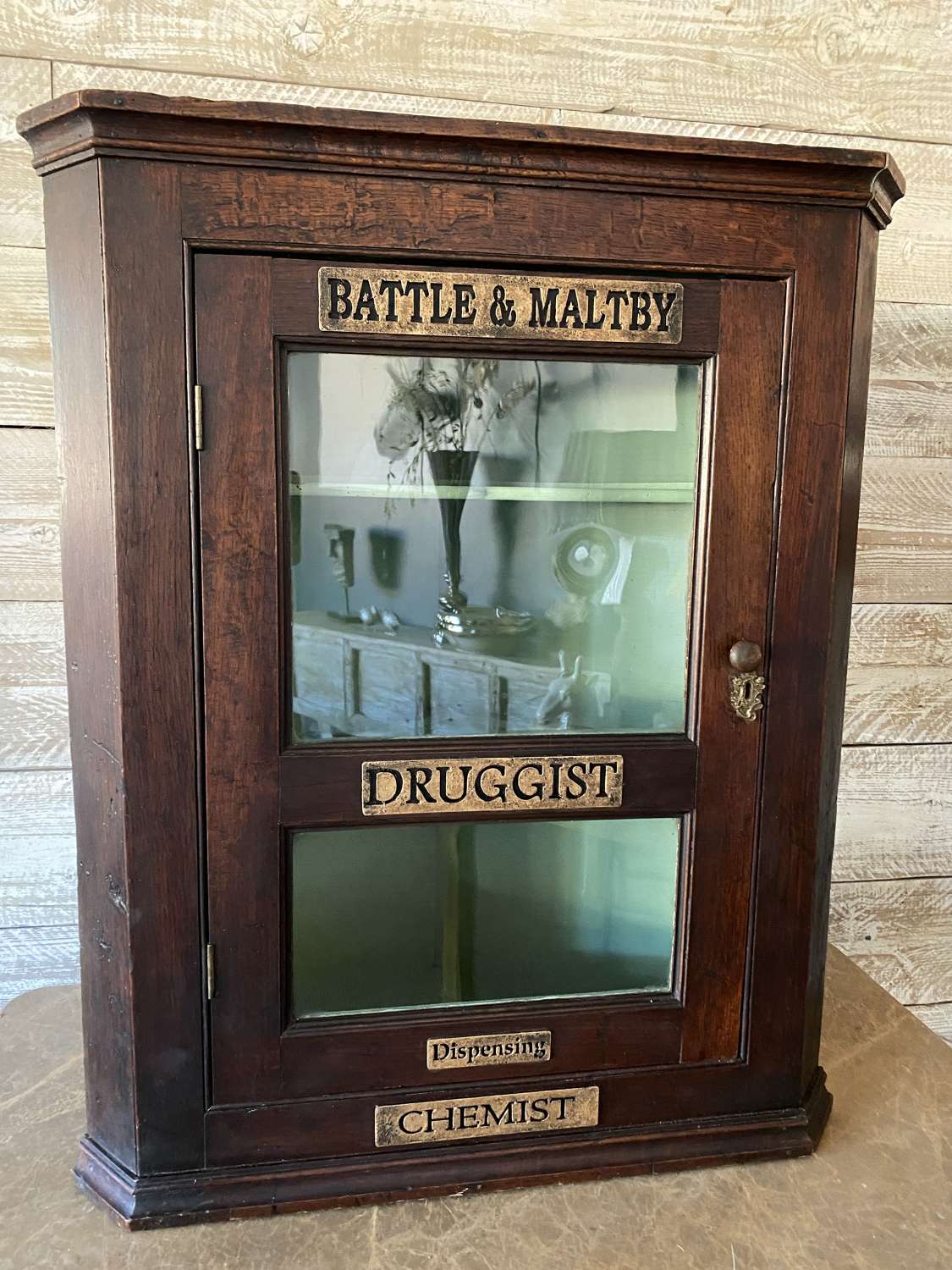 Battle and Maltby Druggist Corner Cabinet