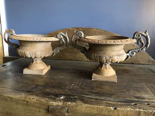 Set of four cast iron urns with handles