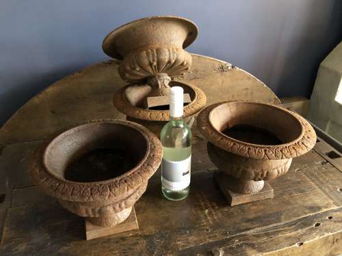 Set of four small Cast Iron Urns