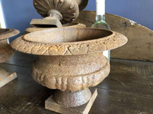 Set of four small Cast Iron Urns