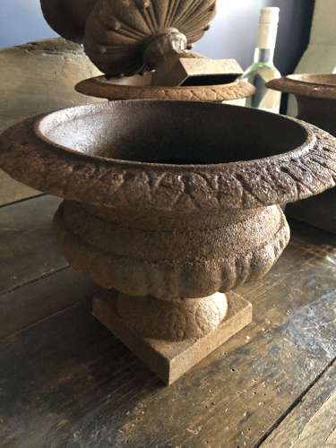 Set of four small Cast Iron Urns
