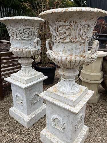 Pair of Cast iron Campagna Urns & Plinths