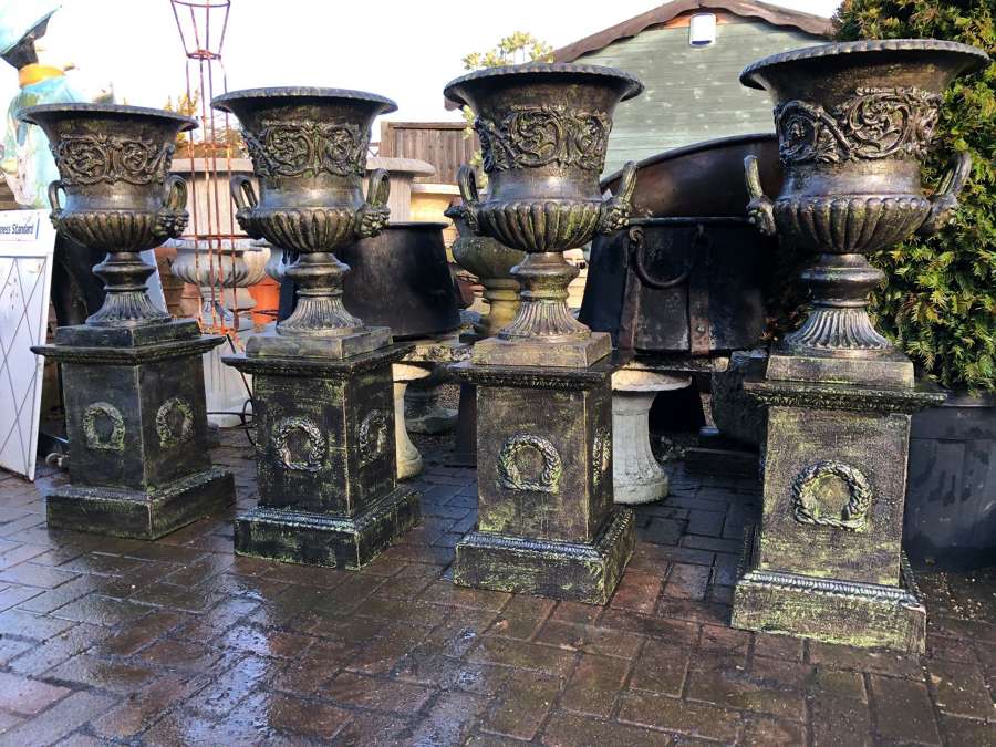 Set of four Cast iron Campagna Urns & Plinths