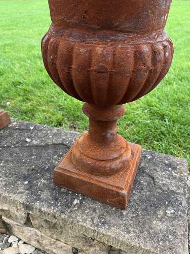 Pair of rusty cast iron urns - cast iron planters