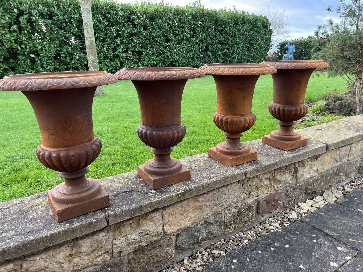 Set of four cast iron urns 43 cm