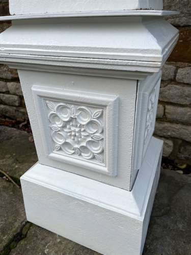 Pair of large cast iron urns & plinths