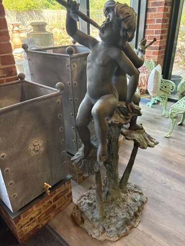 Bronze water feature of 2 boys