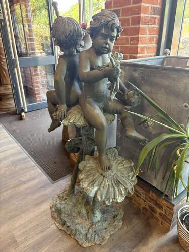 Bronze water feature of 2 boys