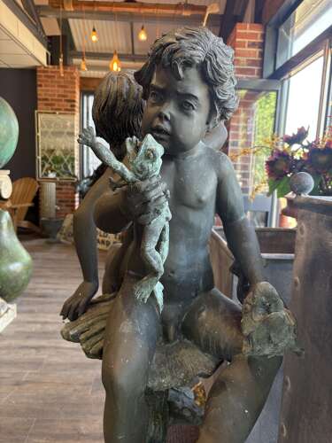 Bronze water feature of 2 boys