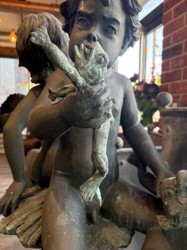 Bronze water feature of 2 boys