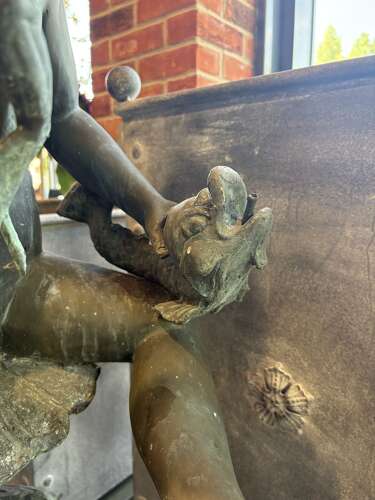 Bronze water feature of 2 boys