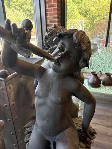 Bronze water feature of 2 boys