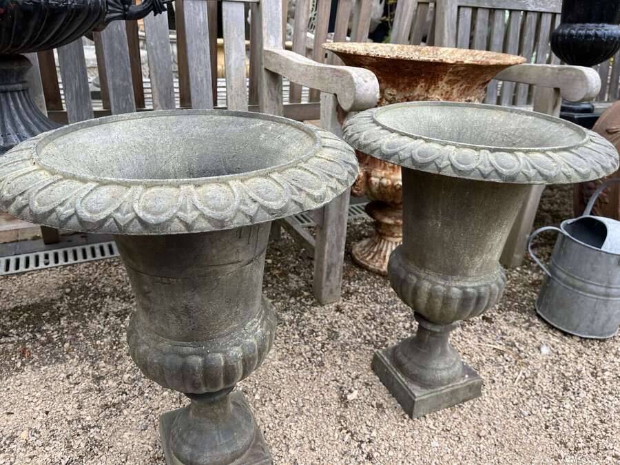 Pair of cast iron urns