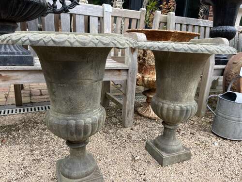 Pair of cast iron urns