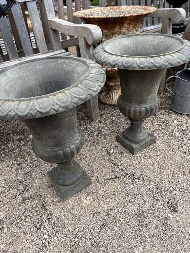 Pair of cast iron urns