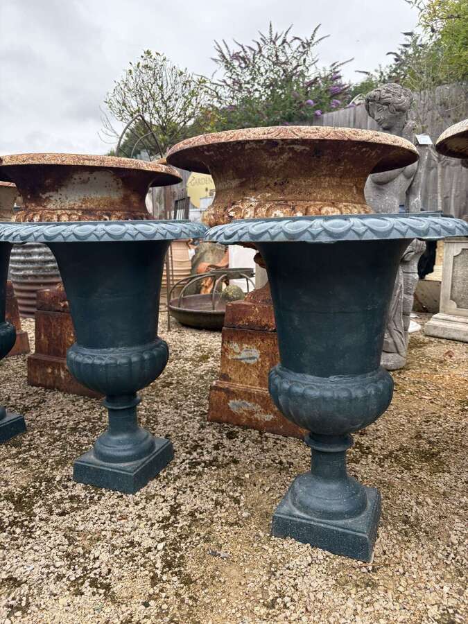 Pair of cast iron urns