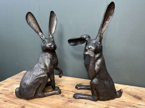 Hare sculpture - bronze hare touching ear.