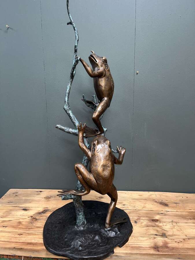 Bronze frogs on branch - bronze frog water feature