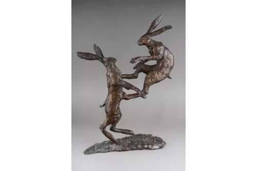Bronze boxing hares - bronze sculpture