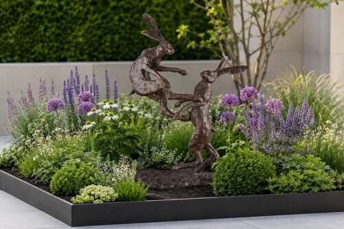 Bronze boxing hares - bronze sculpture