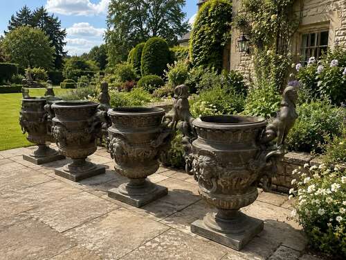 A set of FOUR bronze Versailles vases