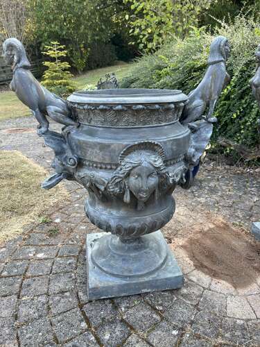 A set of FOUR bronze Versailles vases