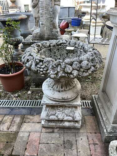 Stone fruit basket planter on plinth