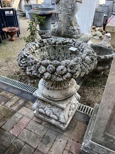 Stone fruit basket planter on plinth