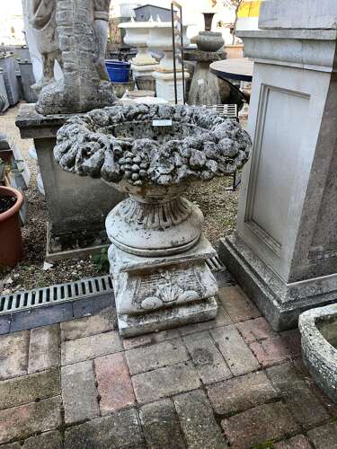 Stone fruit basket planter on plinth