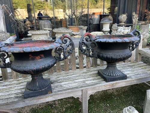Pair of antique cast iron urns with handles
