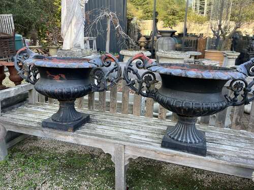 Pair of antique cast iron urns with handles