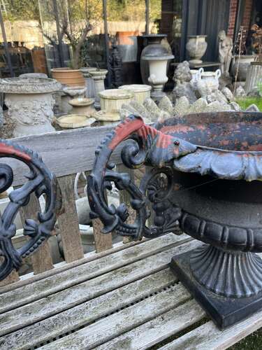 Pair of antique cast iron urns with handles